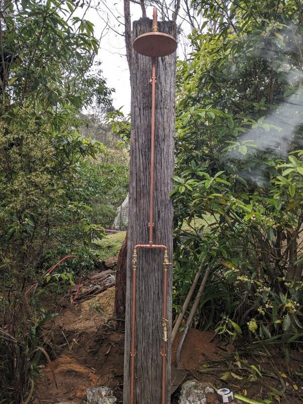 Copper rainhead outdoor shower